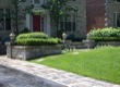 Stone flowerboxes flanking a classic front walk